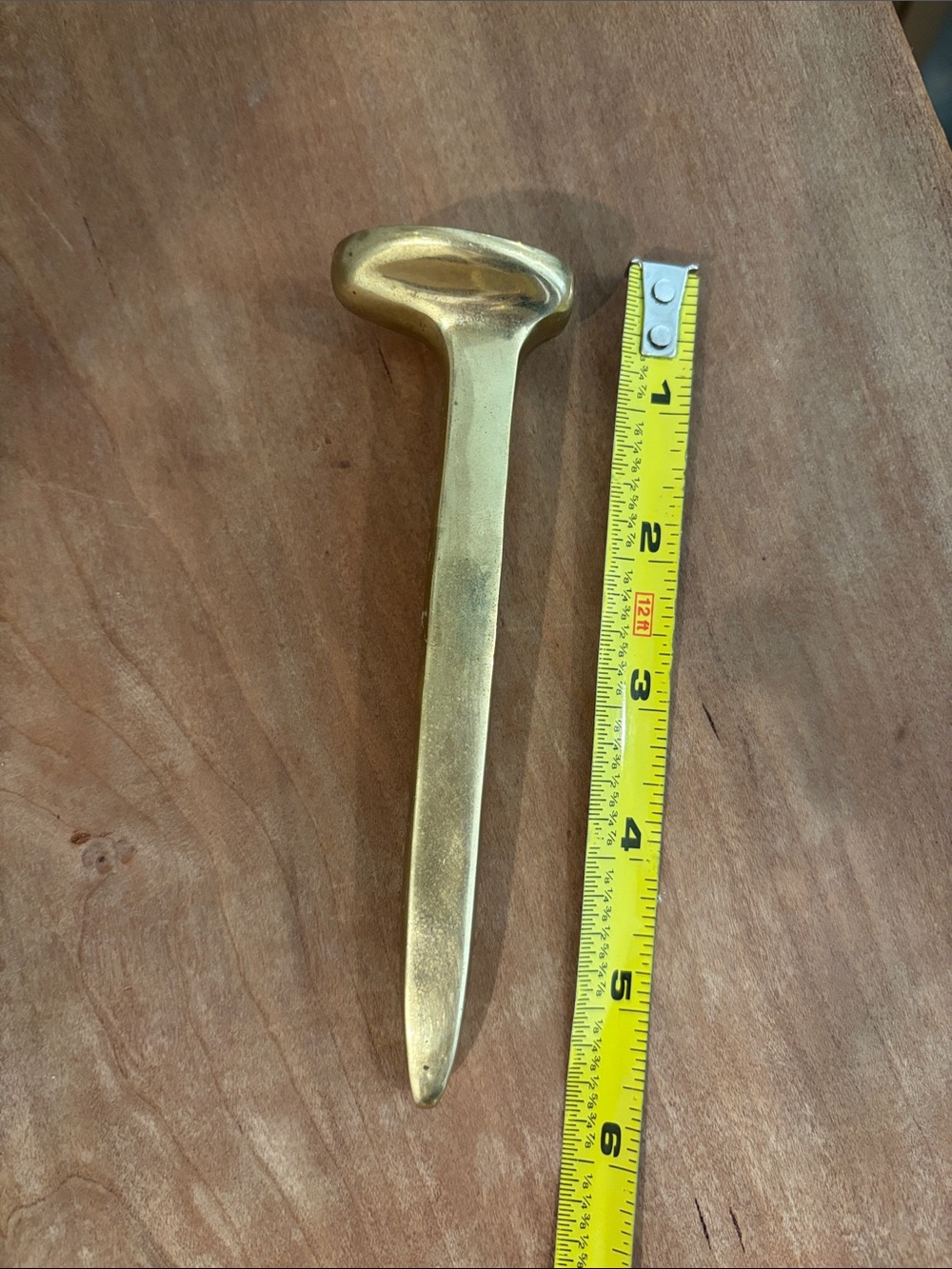 Vintage brass railroad spike